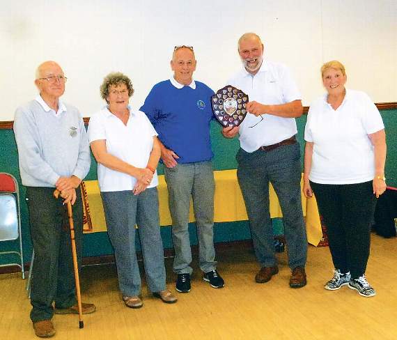 Llanteg receiving the winners trophy from SPSMBA chairman, Norman Hogg: (from left) Peter Walker, Ann Newman, Allen Watts and Sally Watts.