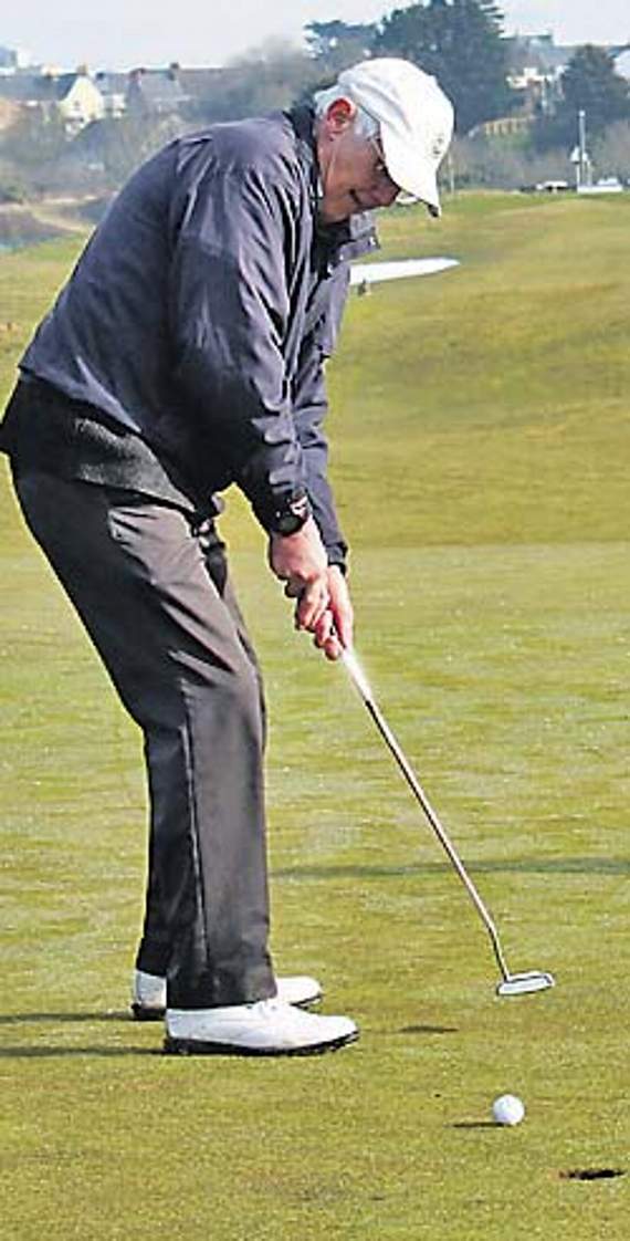 Alan Jones putting out for his eagle on the first.