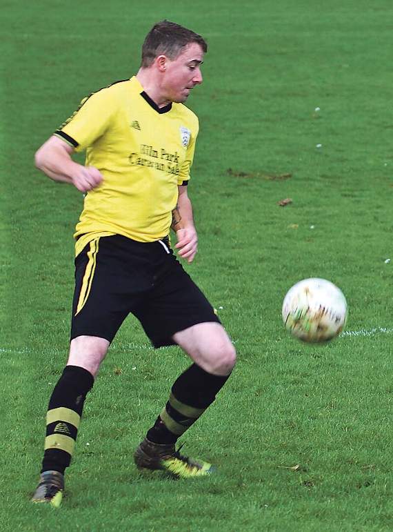 A St. Florence defender clears the ball against Carew Seconds. Pic. Brian McKehon