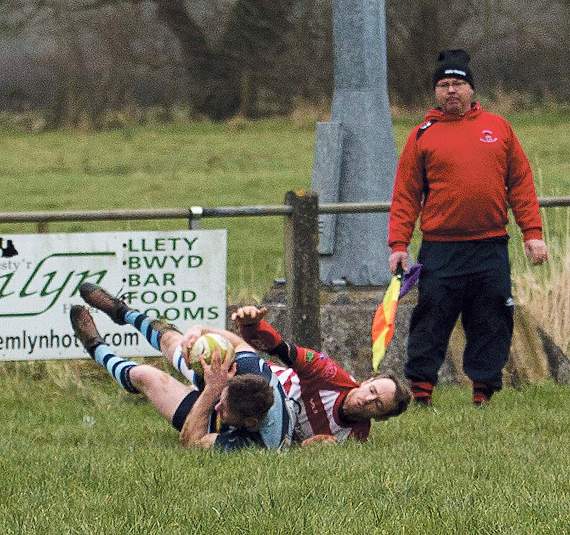 Liam Hutchings tackled at the line about to score the first try. Pic. Elwyn Davies
