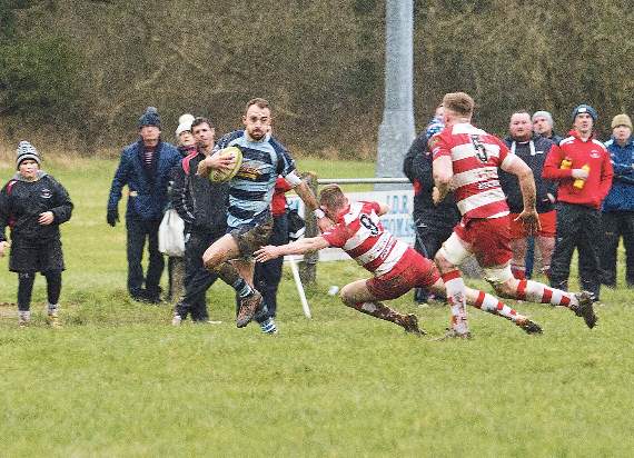 Nick Gale evading Newcastle Emlyn players while making a touchline sprint forward. Pic. Elwyn Davies