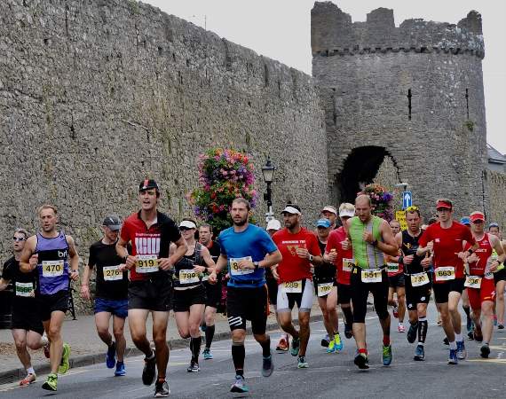 Runners alongside Tenby's town walls