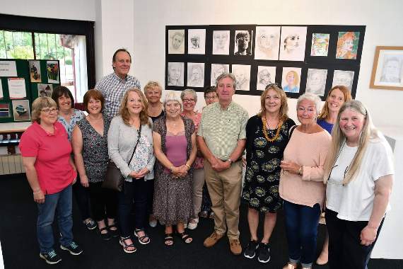 Pictured are the students who have attended Pembroke Dock Community Learning Centre’s art classes, with tutor Phil Allen (centre).