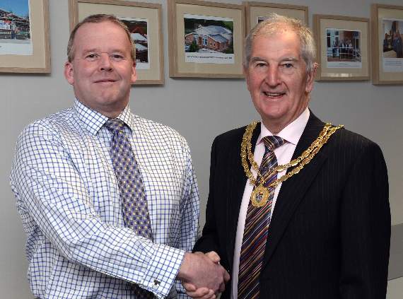 Outgoing chairman Clr. Anthony Mattick passed the chain of office to Clr. Martyn Williams BEM.
