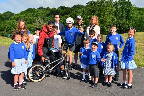 Pupils and headteacher, John Palmer from Tenby VC School are seen with pro BMX rider, Matti Hemmings.