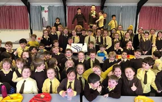 Pupils at the school enjoying the birthday celebrations with the headteacher