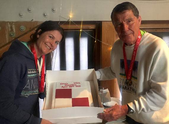 David and daughter Kate with a cake to celebrate his 500th marathon.