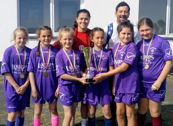 U12s pictured with Ffion Morgan Welsh international player and West Wales ambassador along with coach Ryan Lawrence.