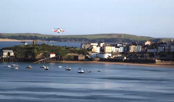 Coastguard Rescue Helicopter 187 heading over Tenby's North Beach (Pic. Callum0808photography)