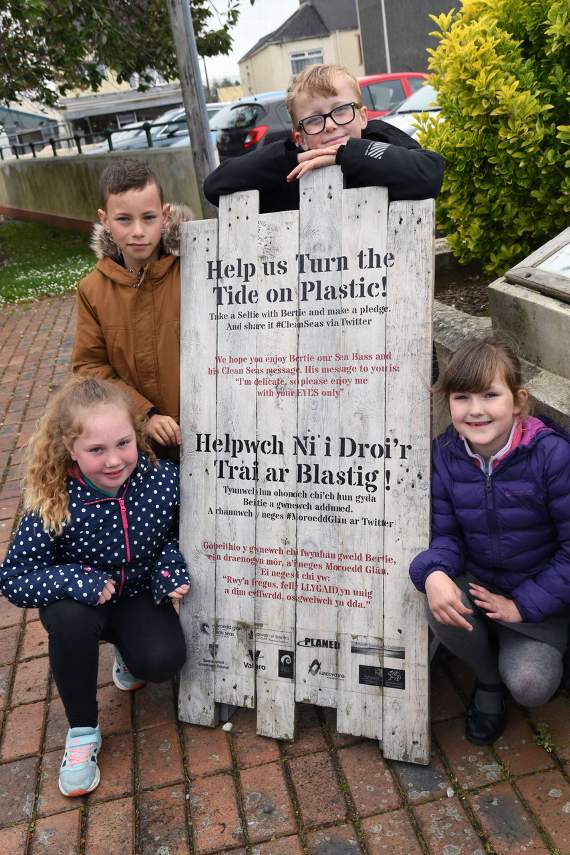 Pupils from Pennar School pictured next to the ‘Clean Seas’ information board recently (Pic. Martin Cavaney)