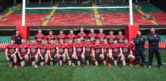 Tenby Utd Youth wearing their rugby tops sponsored by Tenby Round Table