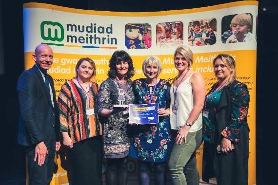 Pictured are Cylch staff Jayne Williams and Christine Evans and committee, chairperson Rhian Rodgers Iraia, secretary Claire Steel and treasurer Kimmy Howells receiving their award from Rhodri Llwyd Morgan of Mudiad Meithrin in Aberystwyth.