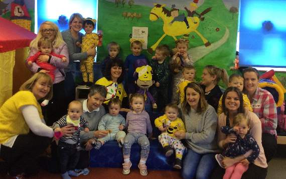 Pictured are staff and toddlers of the Cylch Ti a Fi Hywel Dda group
