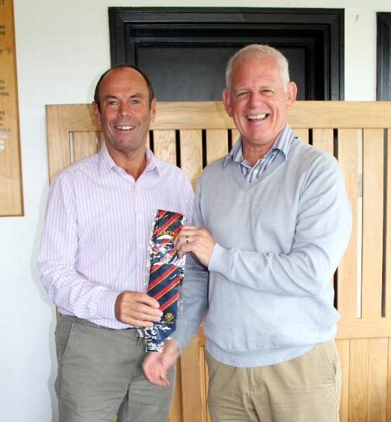 Mick Whale receiving his captain’s tie – now he will have to find a shirt to go with it.