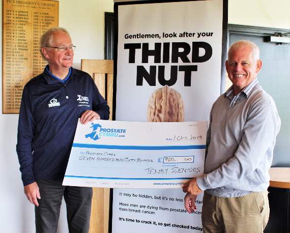 Derek Cole presenting a cheque to Simon Moffett for Prostate Cymru.