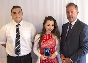 Team of the year captains Jamie Foster and Chloe Fewings with Aaron Flamson
