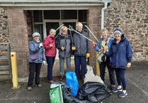 Hardy litter-pickers brave rain