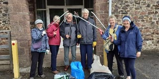Hardy litter-pickers brave rain