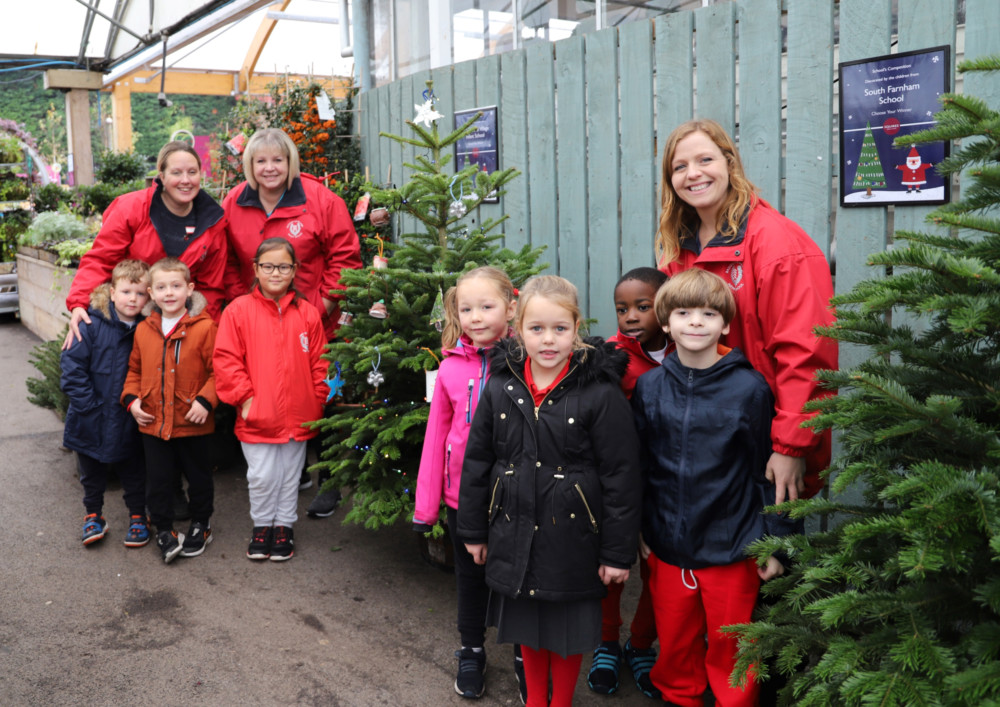 Badshot Lea Village Infant School children hung recycled decorations on a Christmas tree