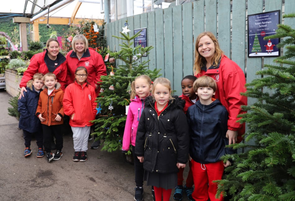 Badshot Lea Village Infant School children hung recycled decorations on a Christmas tree