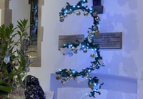 Carols by Christmas tree light at St Peter's
