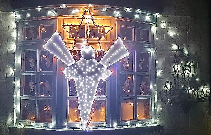 This Grayswood window wishes everyone a merry Christmas