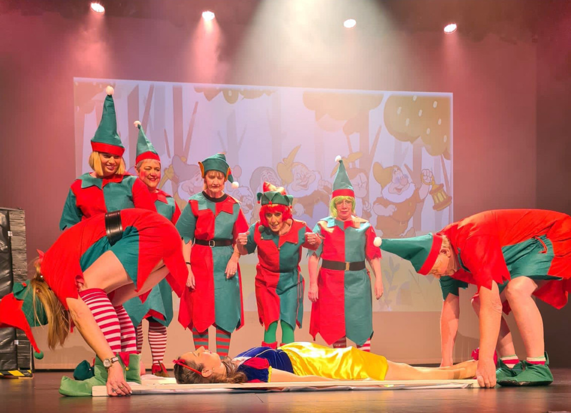 Panto play is halted as Snow White (Claire Aldridge) is stretchered off the stage by two elves while their team-mates look on