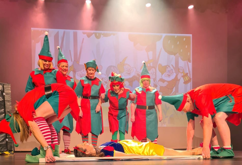 Panto play is halted as Snow White (Claire Aldridge) is stretchered off the stage by two elves while their team-mates look on