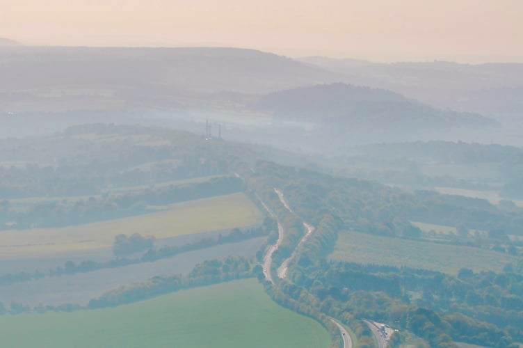 Aerial view looking east along the A31 Hogs Back towards Guildford