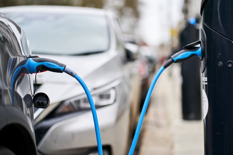 A Tesla car plugged into a Source London EV charging point in central London. Picture date: Friday March 5, 2021.