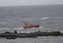 Rowers rescued after their boat capsized in gale force winds