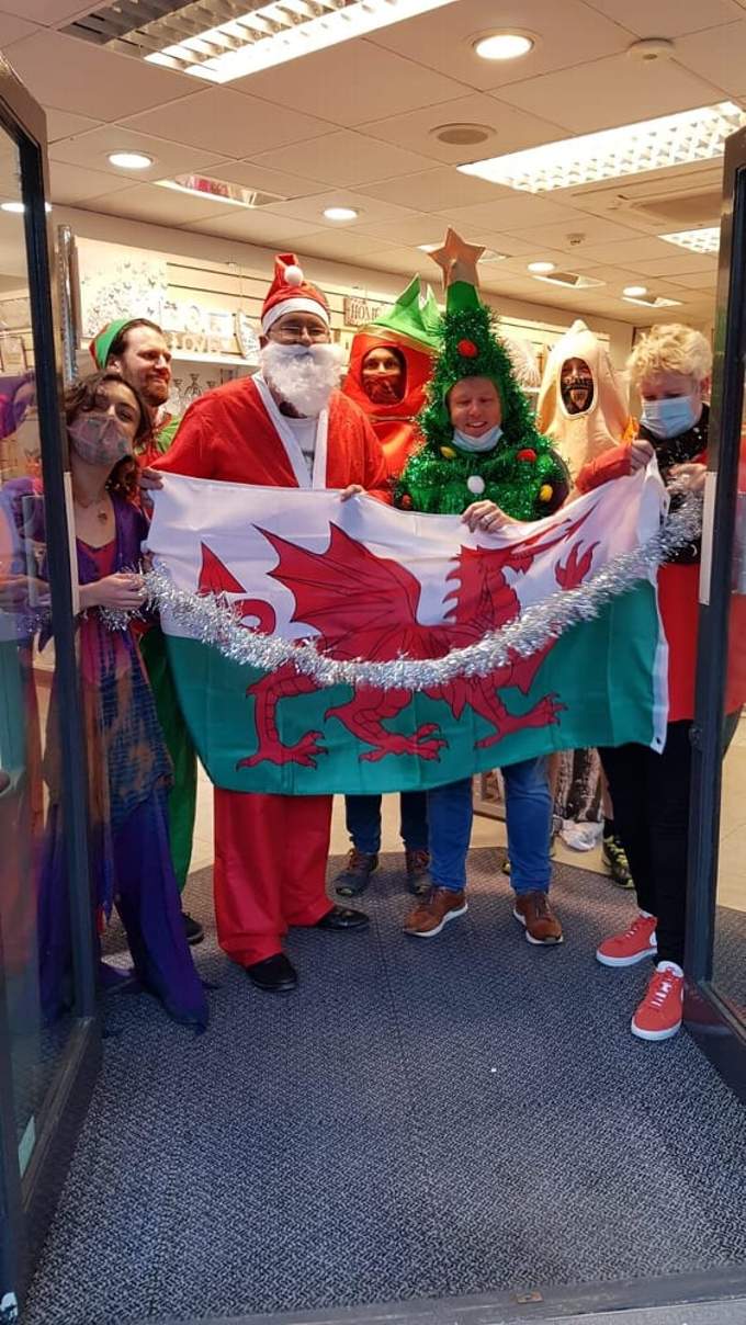 Rob (dressed as a Christmas tree) opened the new shop in Aberystwyth