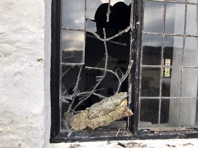 A smashed window at the iconic church