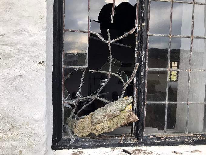 A smashed window at the iconic church