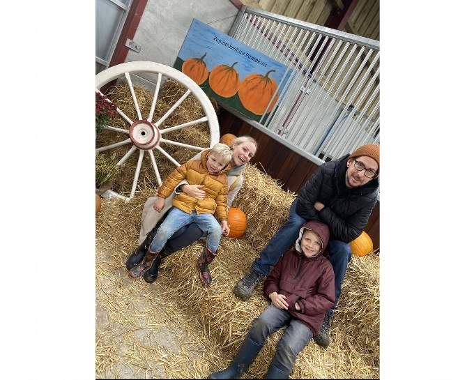 Rufus Palmer with parents Rosie and Tom and younger brother Noah.