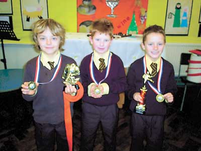 Cody Hayes-Wright, Kieran Johnson and Myles Johnson were awarded their orange belts at karate recently.