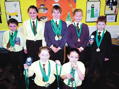 More pupils display their medals and trophies achieved at the Tenby Dolphins Club Championships.