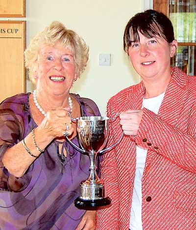 Mary Rowell presenting the Ali David Cup to Cath Jones, lady captain of Ashburnham.