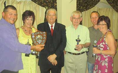 Pictured with Welsh team manager Malcolm Hawkins: A league 1001 winners, 1001 knockout winners, A league runners-up - The Taf.