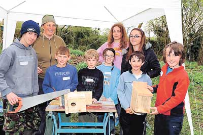 Proud of their carpentry skills in making these bird boxes are Callum, Ross, Tom, Jess, Emily, Elspeth, Joe, Dylan and tutor Caz Phillips.