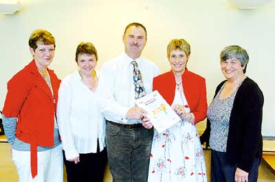 Clr. Huw George and Rosemary Griffiths (right) are pictured with the gold star Saundersfoot team: Myfanwy Lewis, Christine John and Christine Davies.
