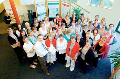 Clr. Huw George and Rosemary Griffiths (front right) are pictured with the award-winning school teams.