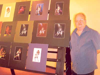 Gareth Martin AWPF with some of his panels of prints.
