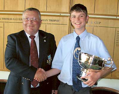 Captain Idwal David presents the Regimental Bowl to young David Webb.