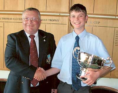 Captain Idwal David presents the Regimental Bowl to young David Webb.