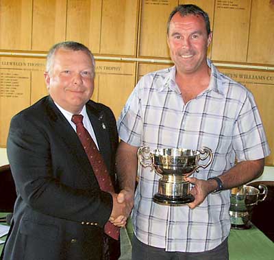 John Morris receives the Cobb Cup from club captain Idwal David.