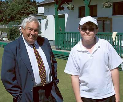 Plate winner Cameron White with club president John Evans.