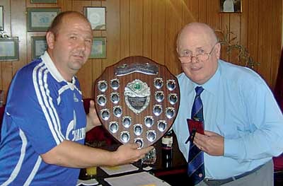 Helmut Reinhardt receiving the most promising referee award from president Danny Thomas.