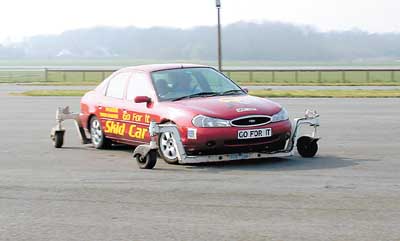 One of the Country Cars volunteers taking the skid car for a spin.
