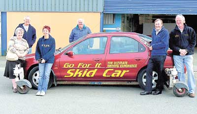 Country Car volunteers pictured after their skid car experience, from left: Margaret Davies, Simon Eggleton, Margaret Vickery, Patrick Hayes, Mike Mansfield and Mike Hughes from Go For It.